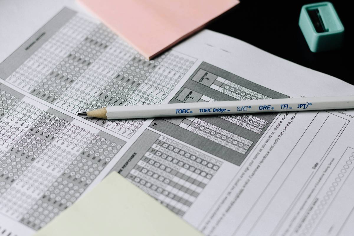 Candidate reviewing supply chain exam prep materials with digital dashboard showing performance metrics